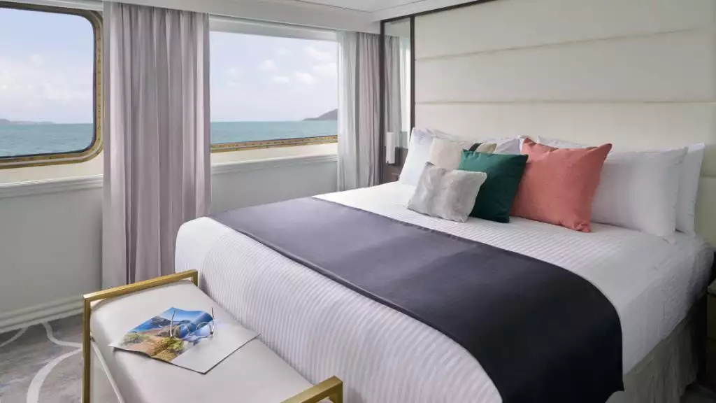 Islander Suite with king-sized bed aboard National Geographic Islander II