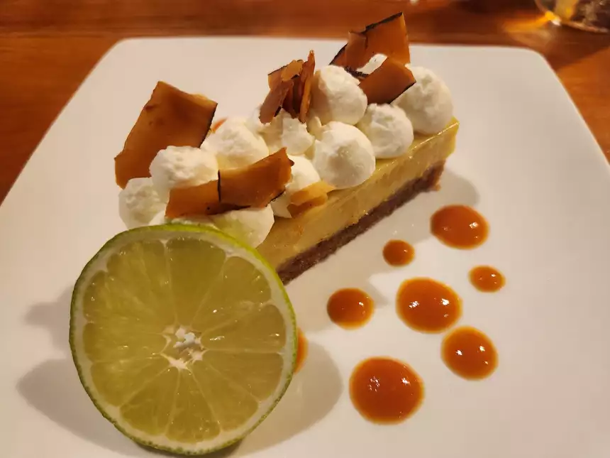 plated Key lime pie dessert with lime and plate designs