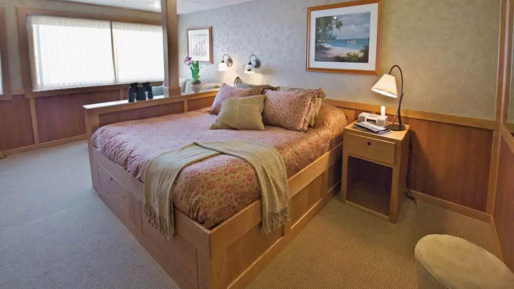 Admiral Stateroom with king bed aboard Safari Explorer