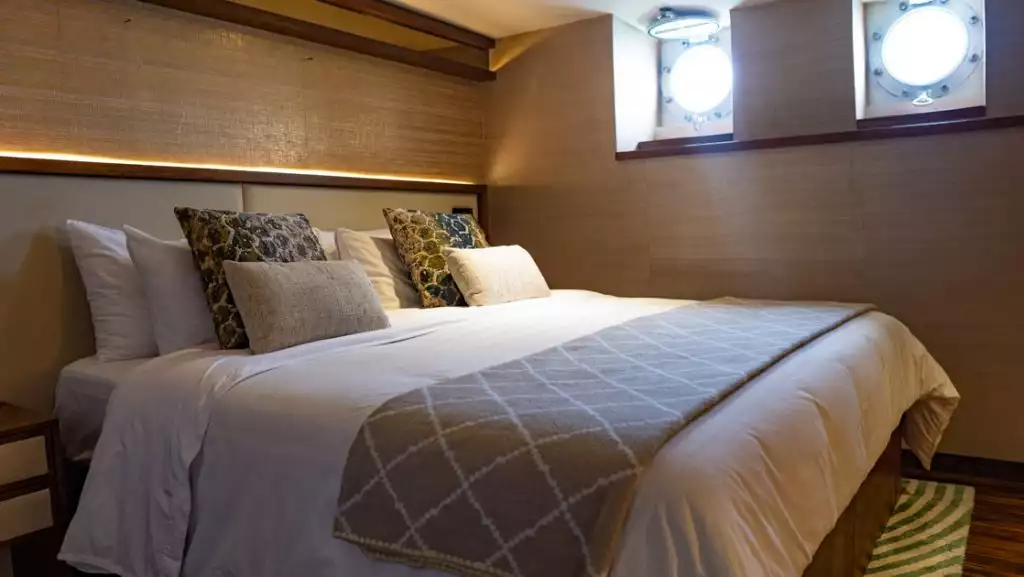 Porthole Stateroom with king bed aboard Kontiki Wayra