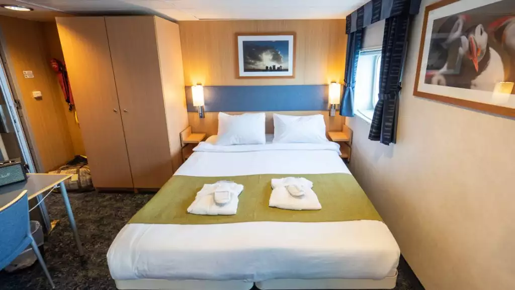 Double Cabin Superior with double bed aboard Quest. Photo by: Eirik Grønningsæter