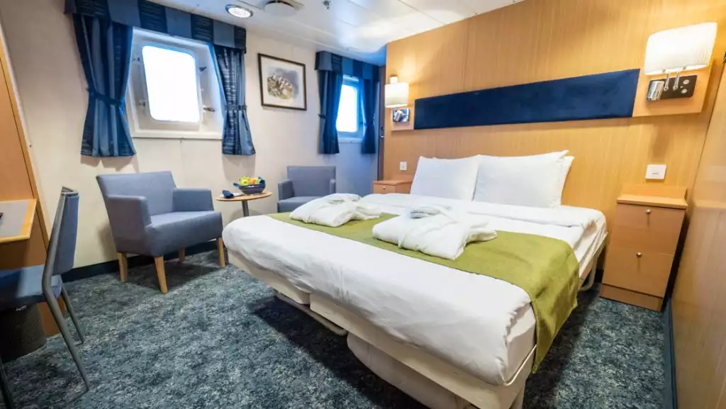 Owner's Cabin with double bed aboard Quest. Photo by: Eirik Grønningsæter