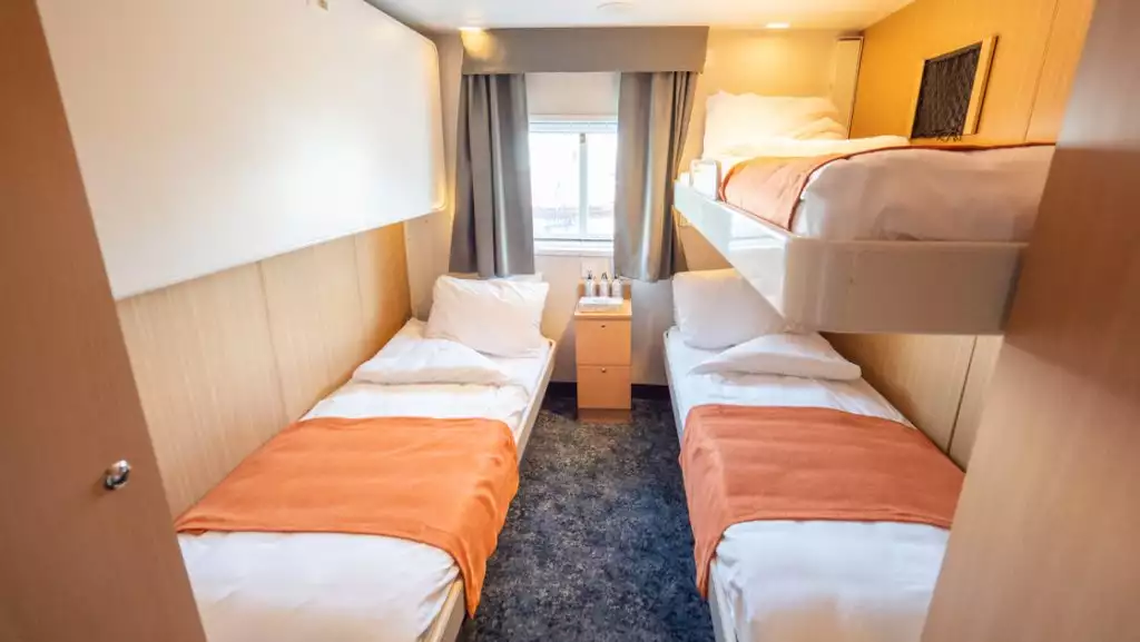 Triple Cabin (twin beds only) aboard Quest. Photo by: Eirik Grønningsæter