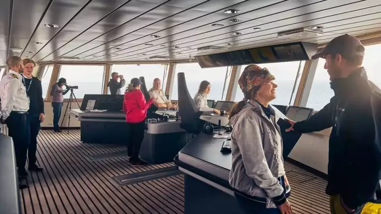 Adventurists explore the captains quarters and control room as they look out into the icy snowy landscape