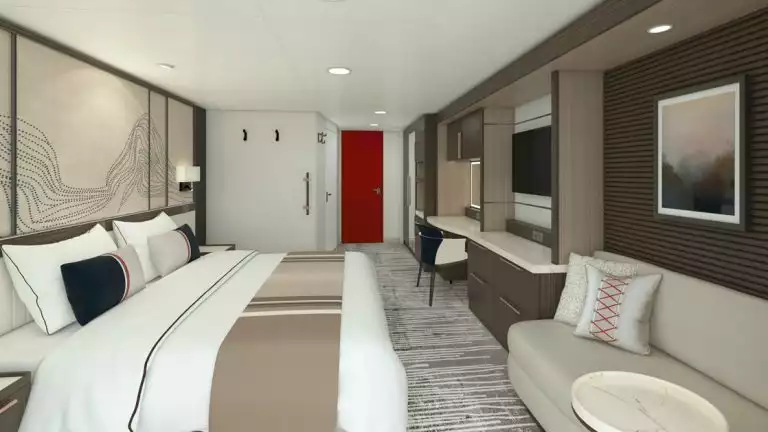 cabin mock up image of modern room with double bed, small couch, a tv, a bathroom and a red door