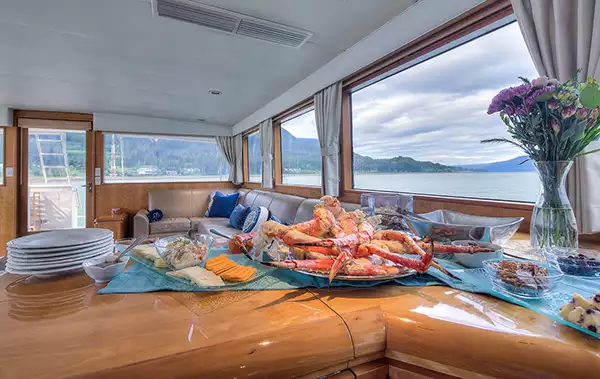 Alaskan crab legs seen on a counter inside of an Alaska yacht charter ship