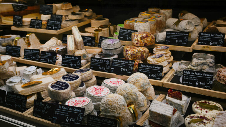 Case of various fine French cheeses, seen at a market on the Traversing the Med: A Mediterranean Feast small ship cruise.