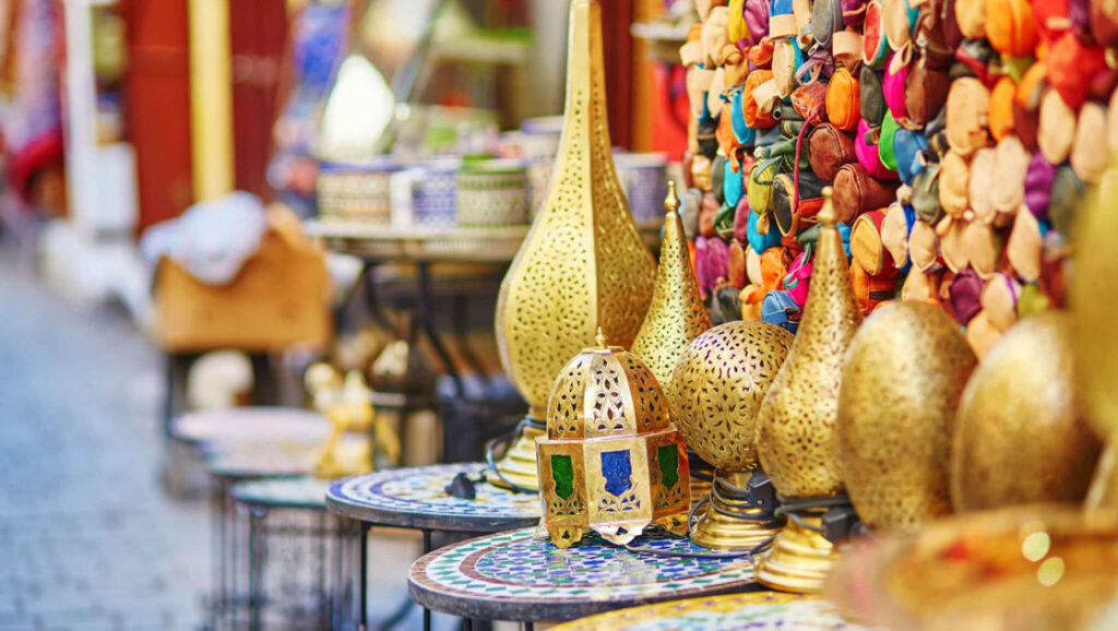 Colorful market wares of gold, stone tile and woven goods at a Morocco market, seen on the Mediterranean Feast cruise.