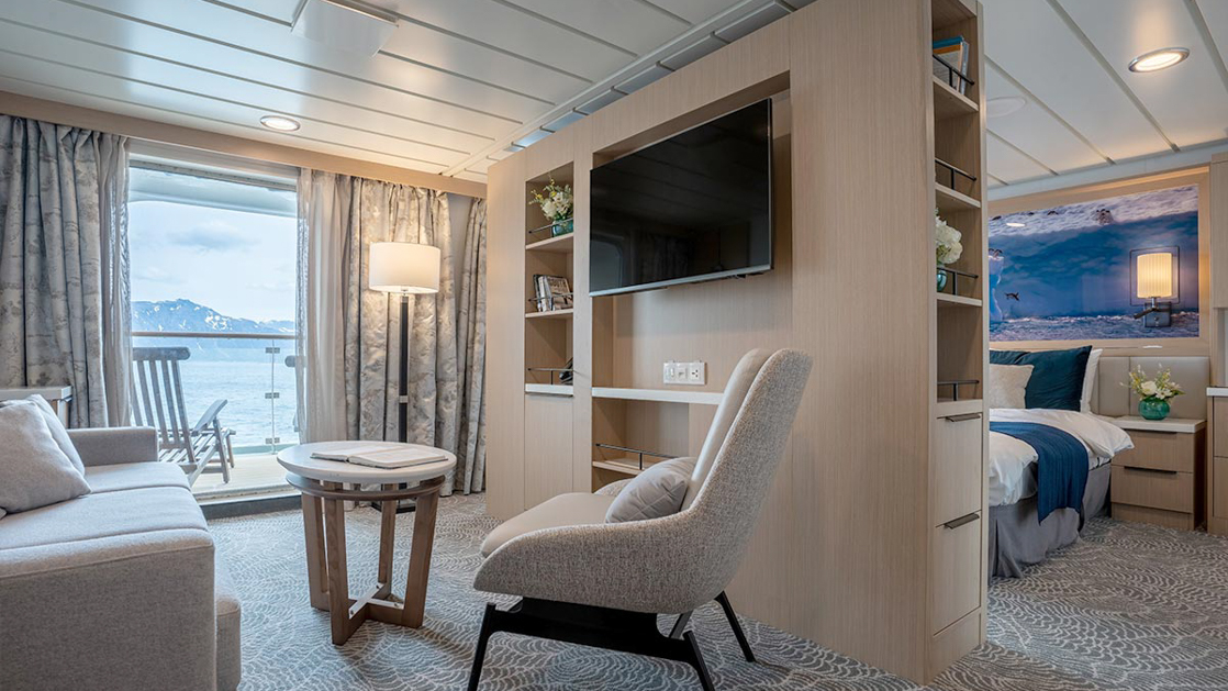 Lounge area in suite with couch and sitting area aboard small cruise ship in antarctica