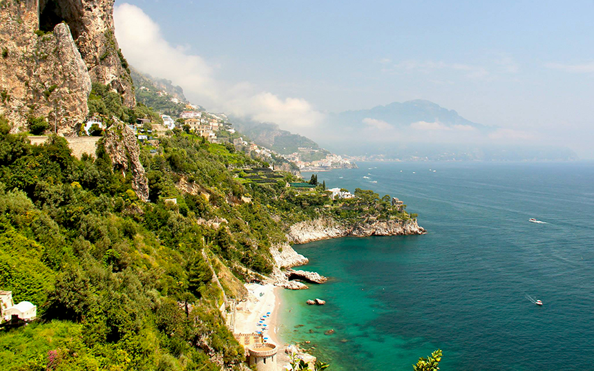 Stunning Amalfi coastline of Italy, Azure waters contrasting with dramatic cliffs and lush greenery. 