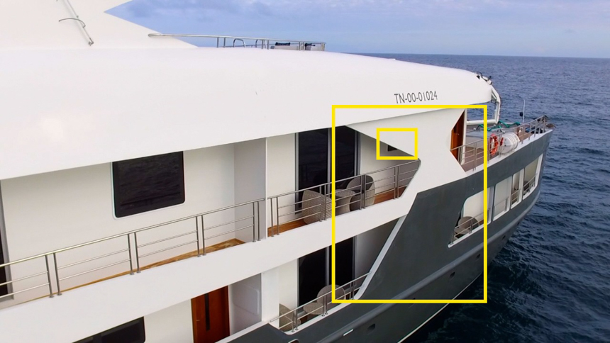 Screenshot of small ship infinity with yellow box to highlight the obstructed views from the cabins