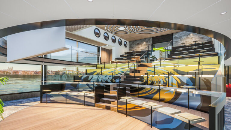 Small wood stage faces 8-10 stadium rows of bench seats in colorful wave decor aboard National Geographic Connect in Europe.