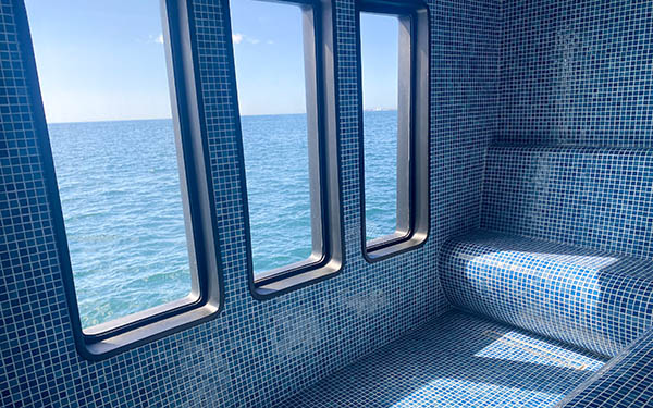 The blue-tiled hammam with three windows aboard Hermes catamaran